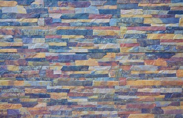 Ceramic tile. Stone brick wall of different colors. Finishing material. Facing brick. Texture. Background.
