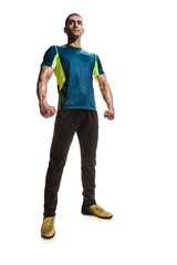 Full photo of young athletic man posing in sportswear on white background
