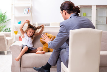 Child psychologist attending small girl