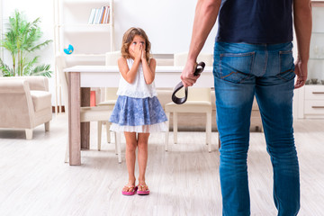 Angry father punishing his daughter - obrazy, fototapety, plakaty