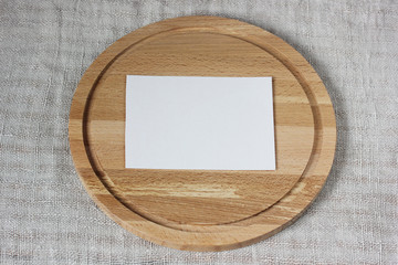 empty cardboard sheet and cutting Board on linen fabric