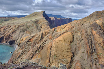 Scenic view of mountain and hills of Point of Saint Lawrence (Ponta de São Lourenço) - the easternmost point of the island of Madeira. Cloudy look of landscape of tropical island in Atlantic ocean
