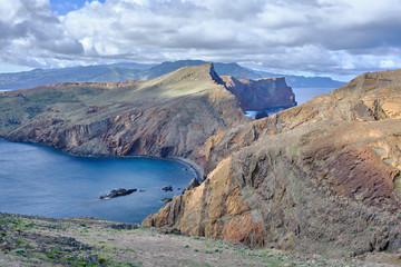 Fototapeta na wymiar Scenic view of mountain and hills of Point of Saint Lawrence (Ponta de São Lourenço) - the easternmost point of the island of Madeira. Cloudy look of landscape of tropical island in Atlantic ocean