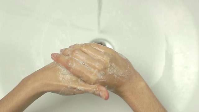 Top view close up of Woman washing hands in slow motion