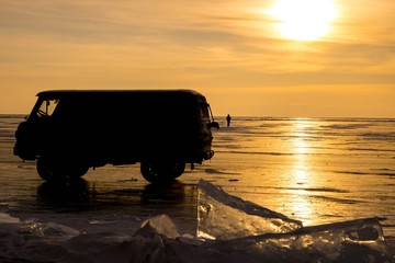 Silhouette of old Russian vans and beautiful sunset over Olkhon Island. Lake Baikal Russia.