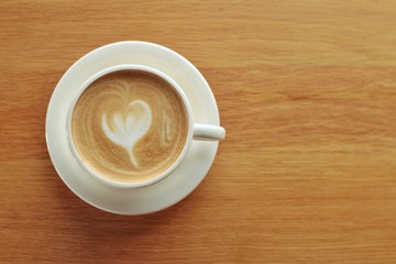 cup of coffee on wooden table
