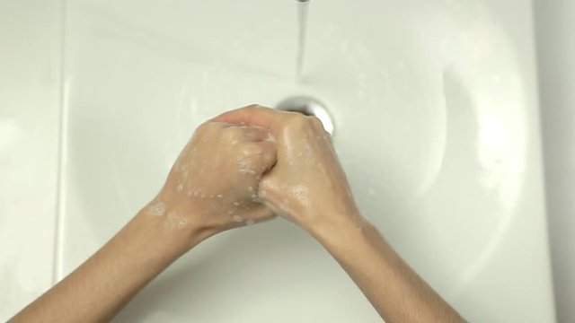 Top view close up of Woman washing hands in slow motion