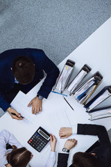 Business people at meeting, view from above. Bookkeeper or financial inspector making report,...