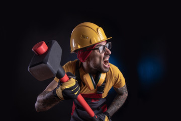 the male construction worker with a sledgehammer