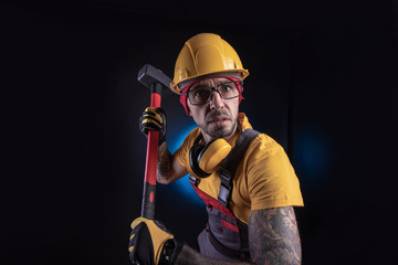 the male construction worker with a sledgehammer