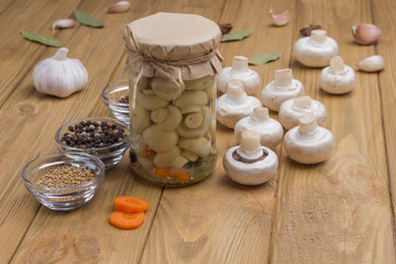 Fototapeta na wymiar Fermentation Products. Glass jar with canned mushrooms.