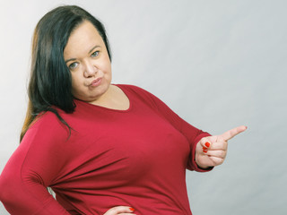 Fototapeta premium Fat woman pointing with finger
