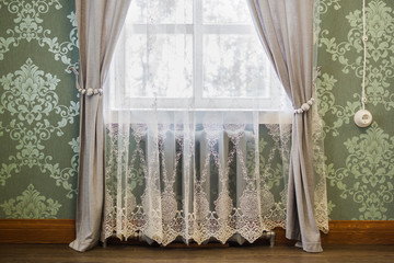 Beautiful curtains on the window for darkness in the room.