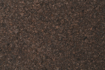 Texture of dark cork with oil finish