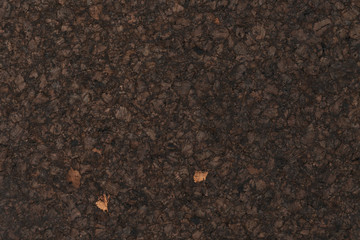 Texture of dark cork with oil finish