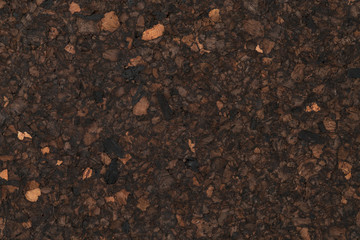 Texture of dark cork with oil finish