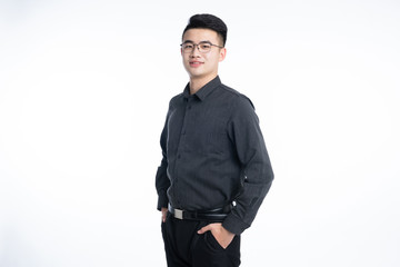 Obraz na płótnie Canvas A young Asian business man stood behind his desk