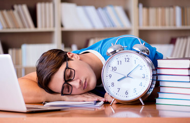 Young student preparing late for his exams