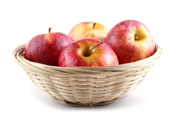 Gala apples on wicker plate