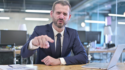 The Angry Young Businessman Screaming on Camera in Office