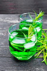 Lemonade Tarragon in two glasses on black wooden board