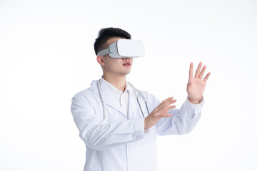A young Asian doctor is using a device