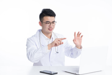 A young Asian doctor is using a device