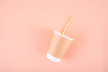 Paper glass with drinking tubes. Eco utensils on a light background. Zero waste.Sustainable lifestyle concept