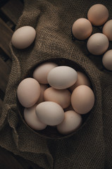 Natural, organic eggs in wooden bowl, zero waste Easter
