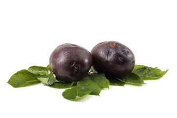 Violet potatoes on leaves