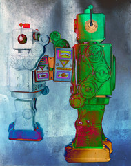 two retro robots high five each other