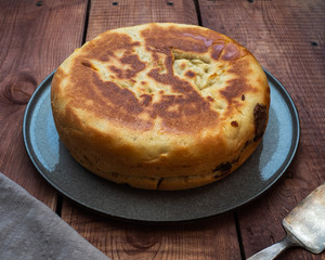 Homemade freshly baked pie on a gray platet