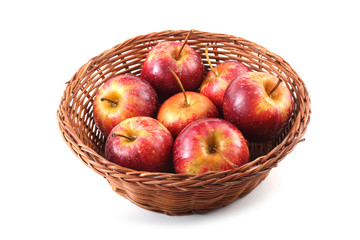 Little apples on wicker plate
