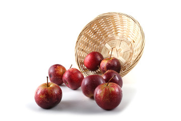 Little apples and wicker plate