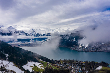 aerial shot of lake zell with alps mountains on the background, zell-am-see