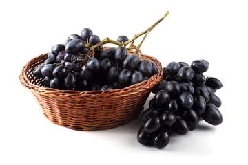 Black grape on wicker plate