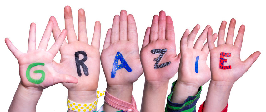 Children Hands Building Colorful Italian Word Grazie Means Thank You. White Isolated Background