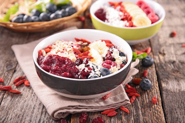 smoothie bowl with berry fruit, blueberry, banana, goji, cranberry