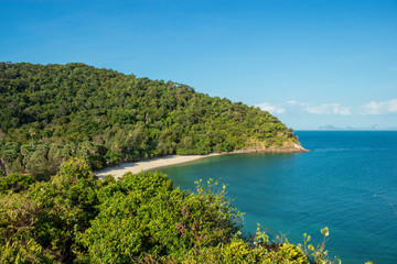 Naklejka premium The rocky beach in Ko Lanta National Park. In the evening, the team saw the lighthouse with clear sky.