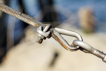 stainless steel turnbuckle hook and steel wire cable rope connection ties and connections concept. bracing and securing concept.