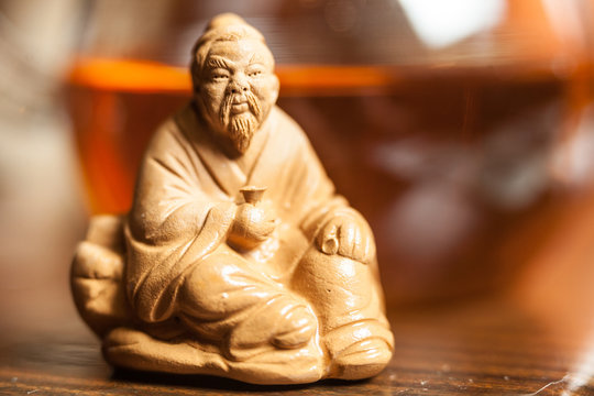 chinese buddah sculpture on the table