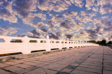 Asphalt roads and Bridges in the background of blue sky and white clouds