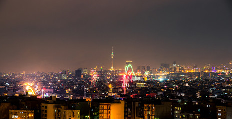 Beautiful and colorful skyline of Tehran city the capital of Iran with amazing fire works in the sky.