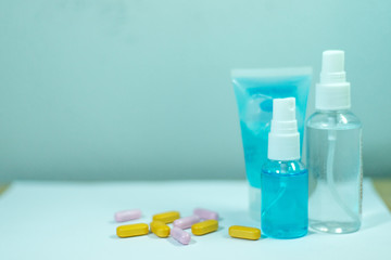 Anti-Covid-19 drugs and alcohol clean hands And a Corona or Covid-19 (SARS-CoV-2) virus protection mask.