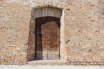 Old Wooden Door on Grunge Brick Wall