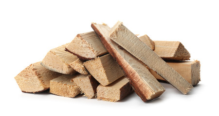 Cut firewood on white background. Heating in winter