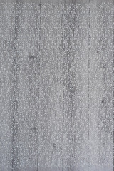 White wooden background with white spring flowers roses and lace ribbon. Happy womans day. The texture of lace on wooden background.