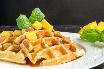 homemade Belgian waffles with caramel syrup.