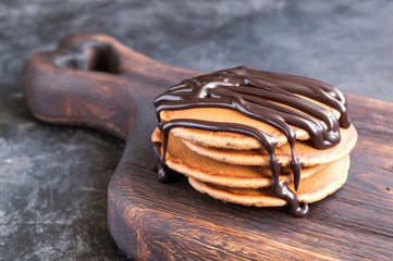 homemade chocolate pancakes with chocolate syrup.