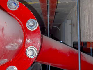 Blurred Fire pump system with big red pipe line system background